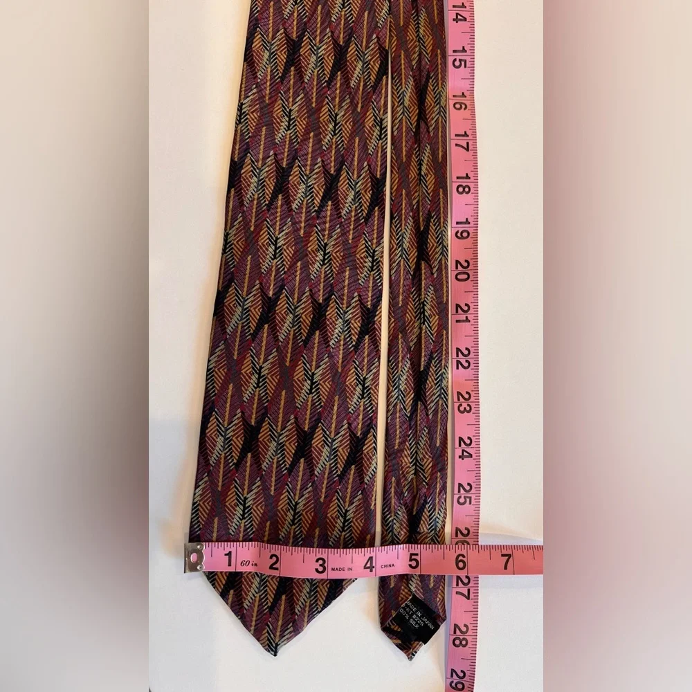 Vintage tie with price tag that has a history Jhane Barnes Abstract design